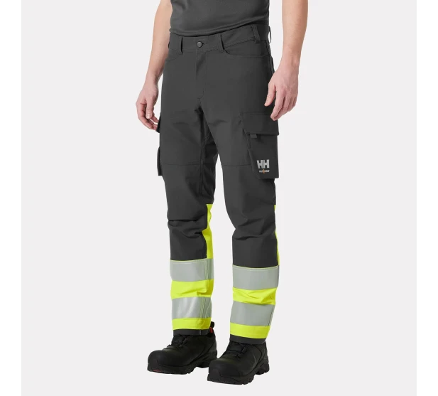 IKH HH ALNA 4X CARGO Joustavat tyohousut reisitaskuilla Huomiovarina Hi Vis keltainen Tuotekoodi HH77433 369 koko Saarenpaa Oy Kuva 1 kuva