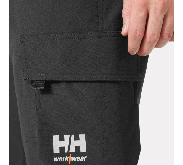 IKH HH ALNA 4X CARGO Joustavat tyohousut reisitaskuilla Huomiovarina Hi Vis keltainen Tuotekoodi HH77433 369 koko Saarenpaa Oy Kuva 3 kuva